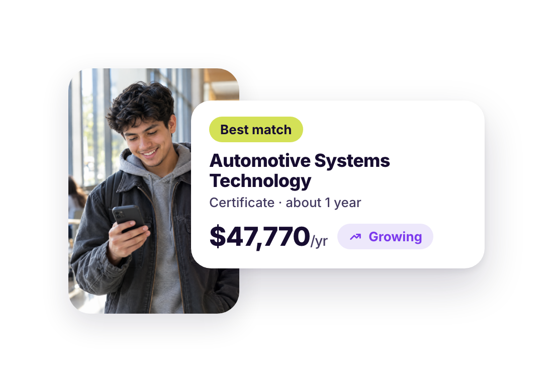A student checks his phone next to a Kenii best match: Automotive Systems Technology, a certificate of about one year, with regional wages of $47,770 a year and growing demand.